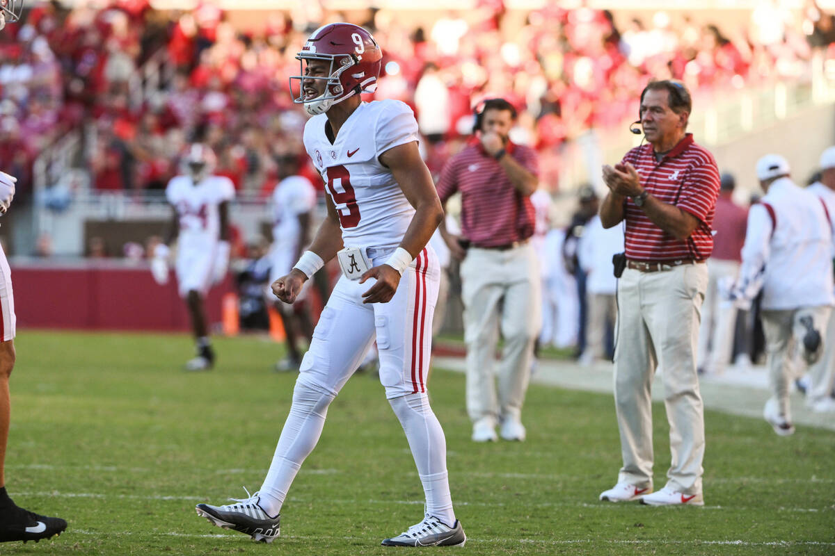 Alabama quarterback Bryce Young and coach Nick Saban celebrate a touchdown against Arkansas dur ...