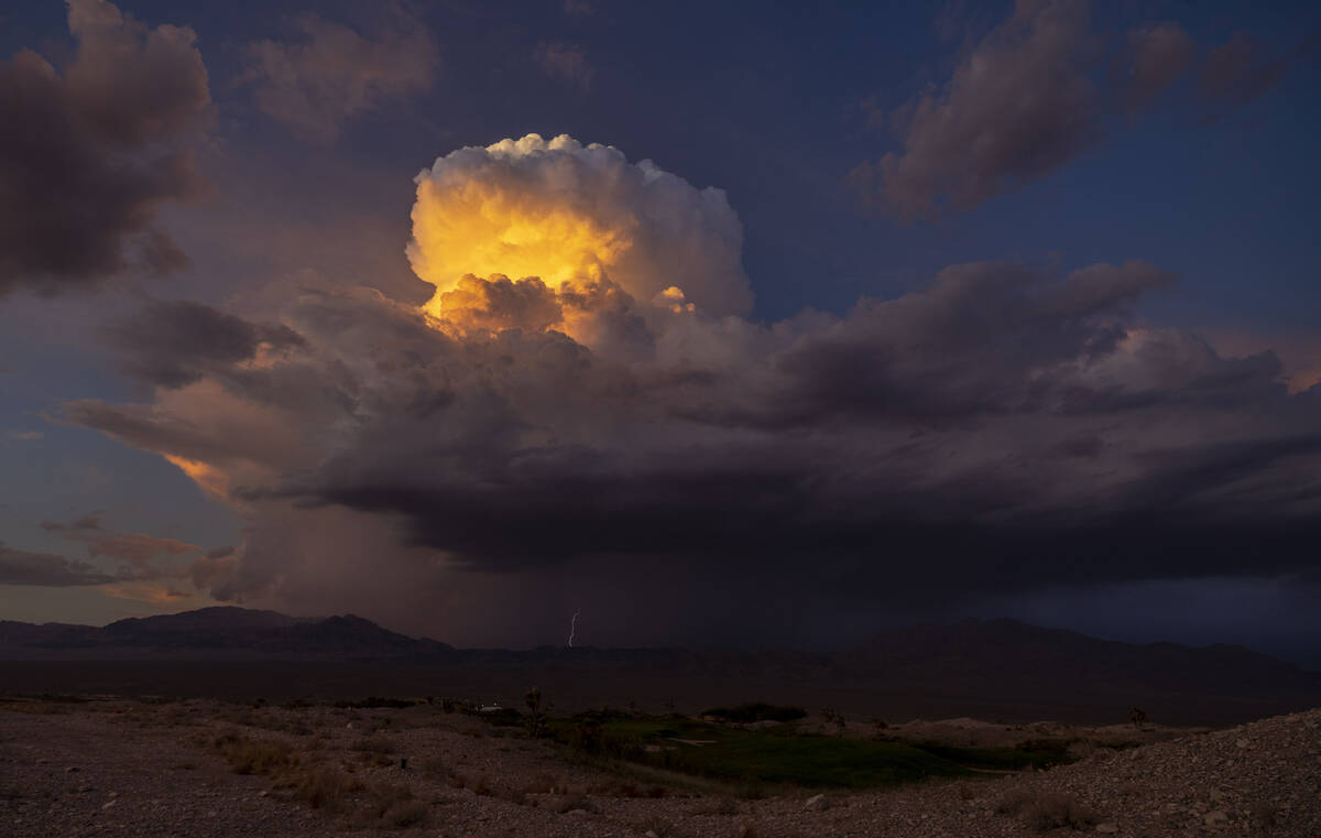Lightning erupts as a monsoon storm moves across the valley on Thursday, Aug. 11, 2022, in Las ...