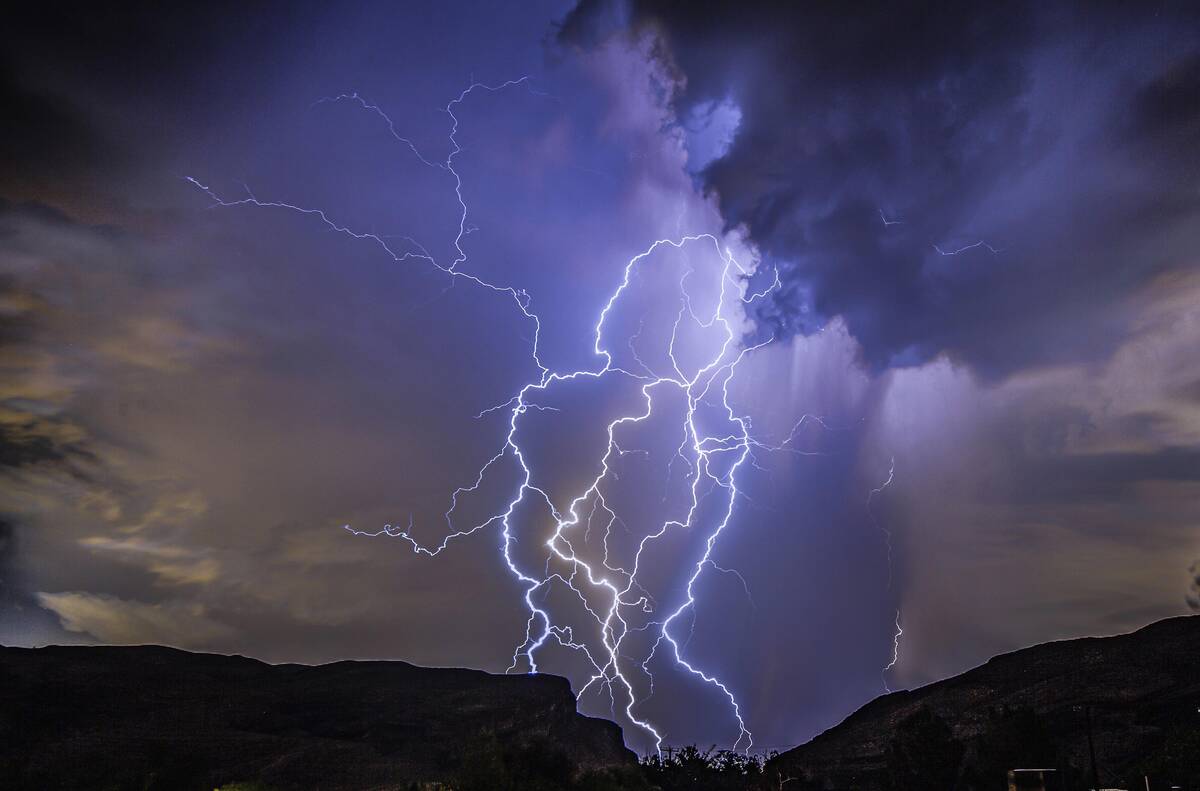 In this photo provided by Dakota Snider, a thunderstorm is seen from Highway 159 over Las Vegas ...