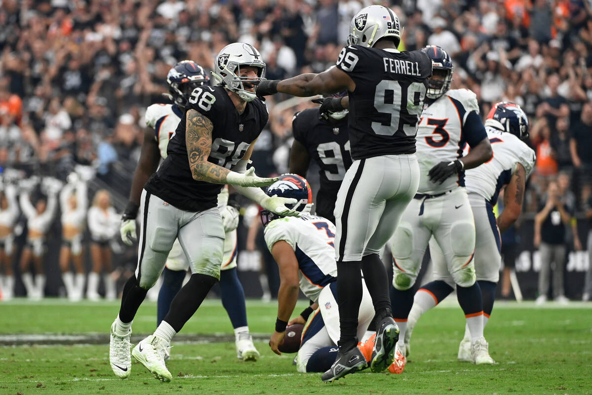 Las Vegas Raiders defensive end Maxx Crosby (98) celebrates his sack of Denver Broncos quarterb ...