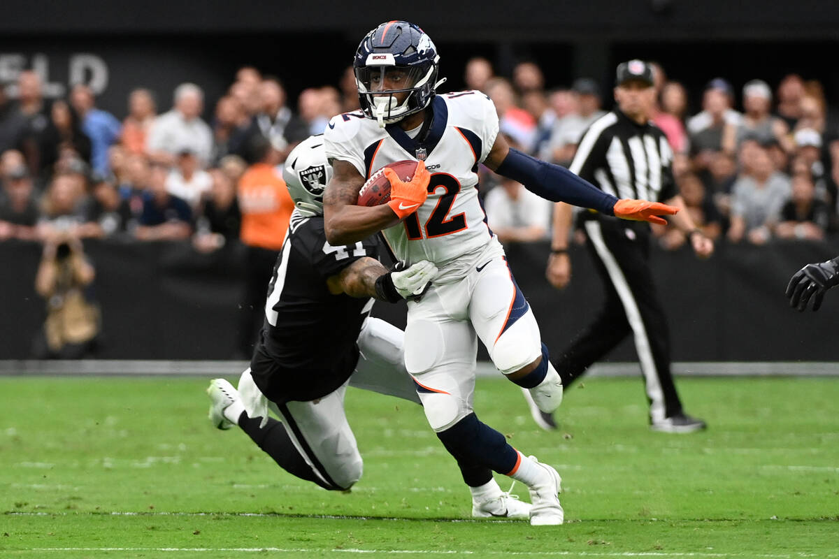 Denver Broncos wide receiver Montrell Washington (12) runs after the catch as Las Vegas Raiders ...