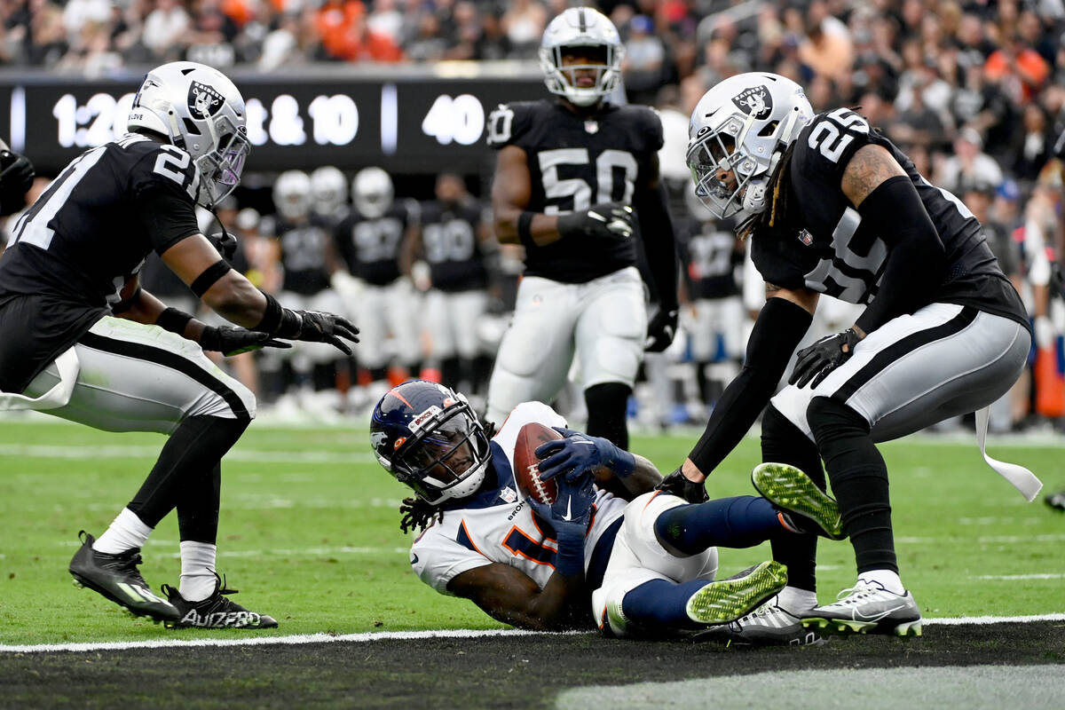 Denver Broncos wide receiver Jerry Jeudy (10) slides in for a touchdown as Las Vegas Raiders sa ...