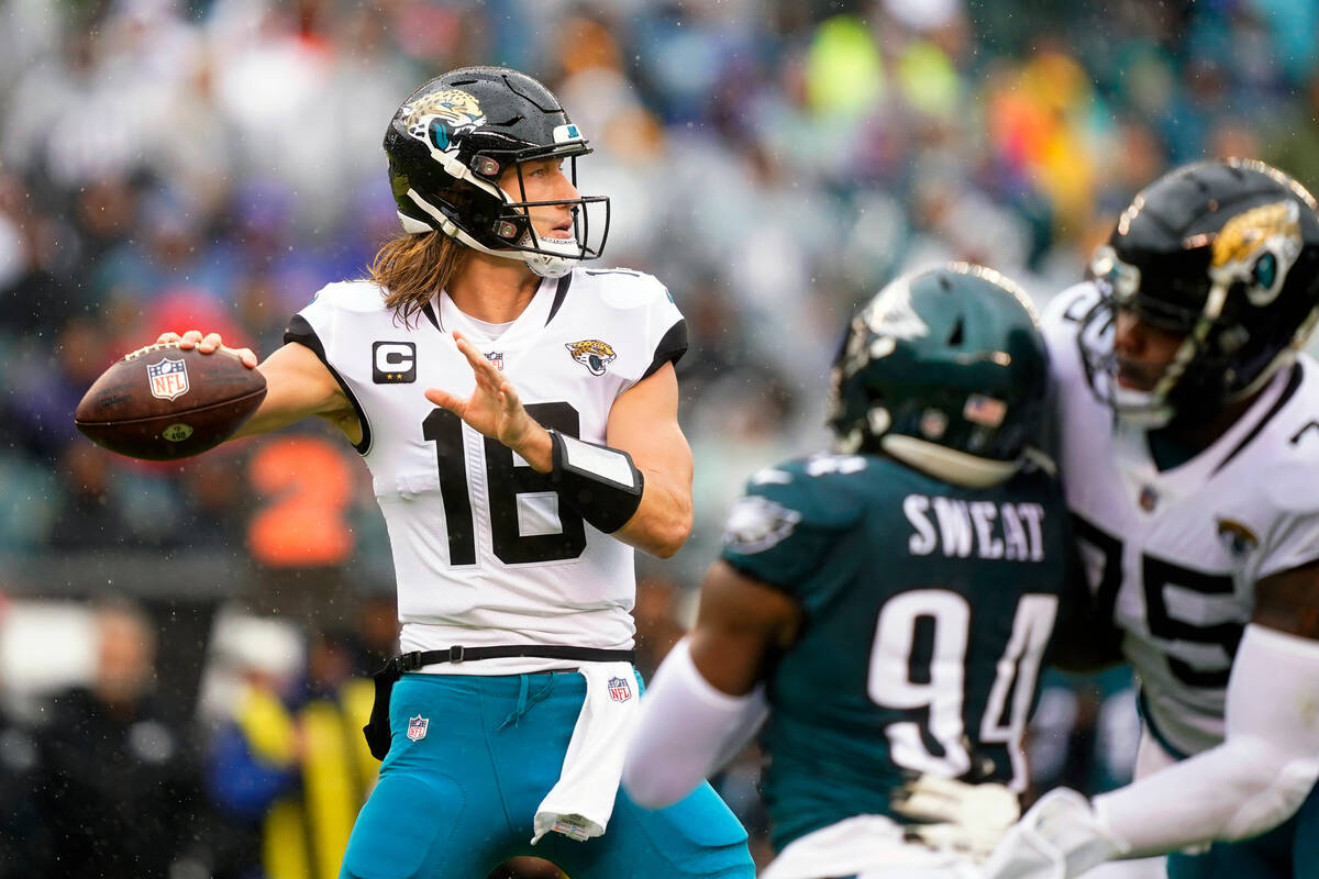 Jacksonville Jaguars' Trevor Lawrence looks to pass during the first half of an NFL football ga ...