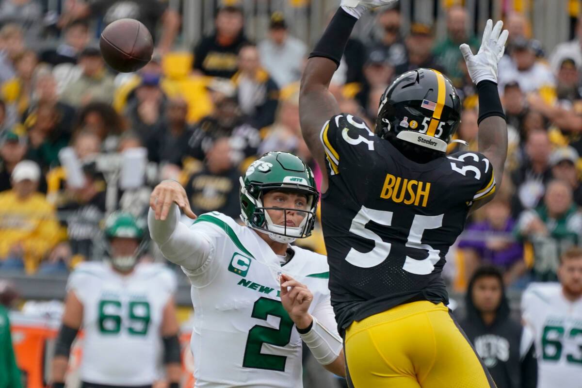 New York Jets quarterback Zach Wilson (2) passes as Pittsburgh Steelers linebacker Devin Bush ( ...