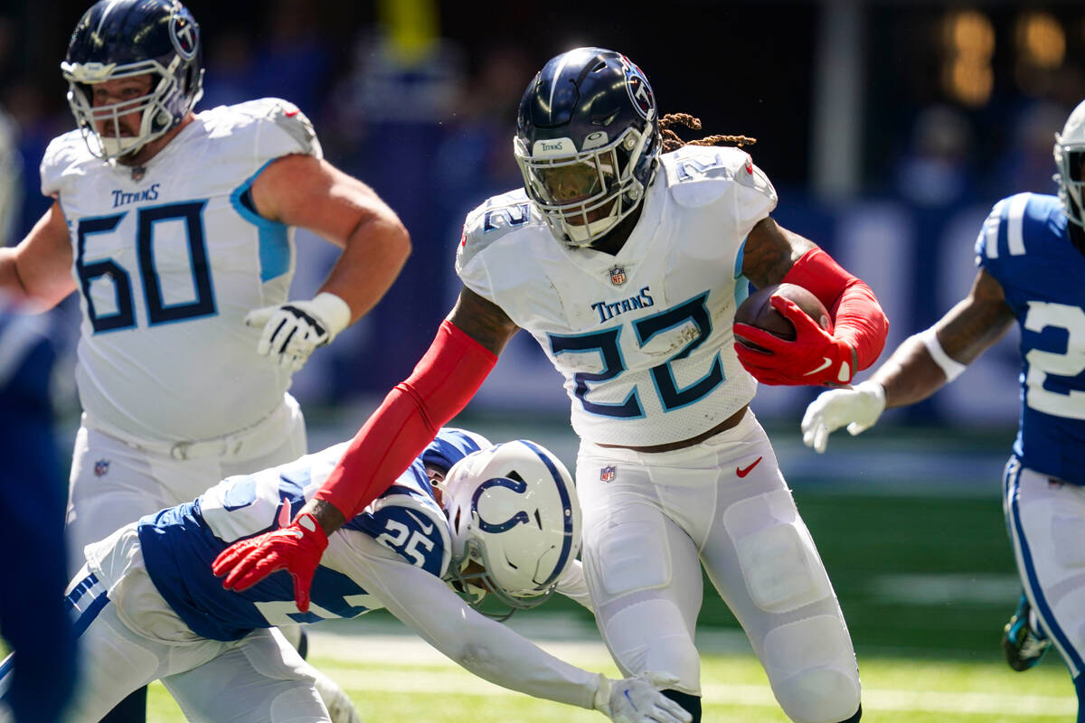 Tennessee Titans running back Derrick Henry pushes off Indianapolis Colts safety Rodney Thomas ...