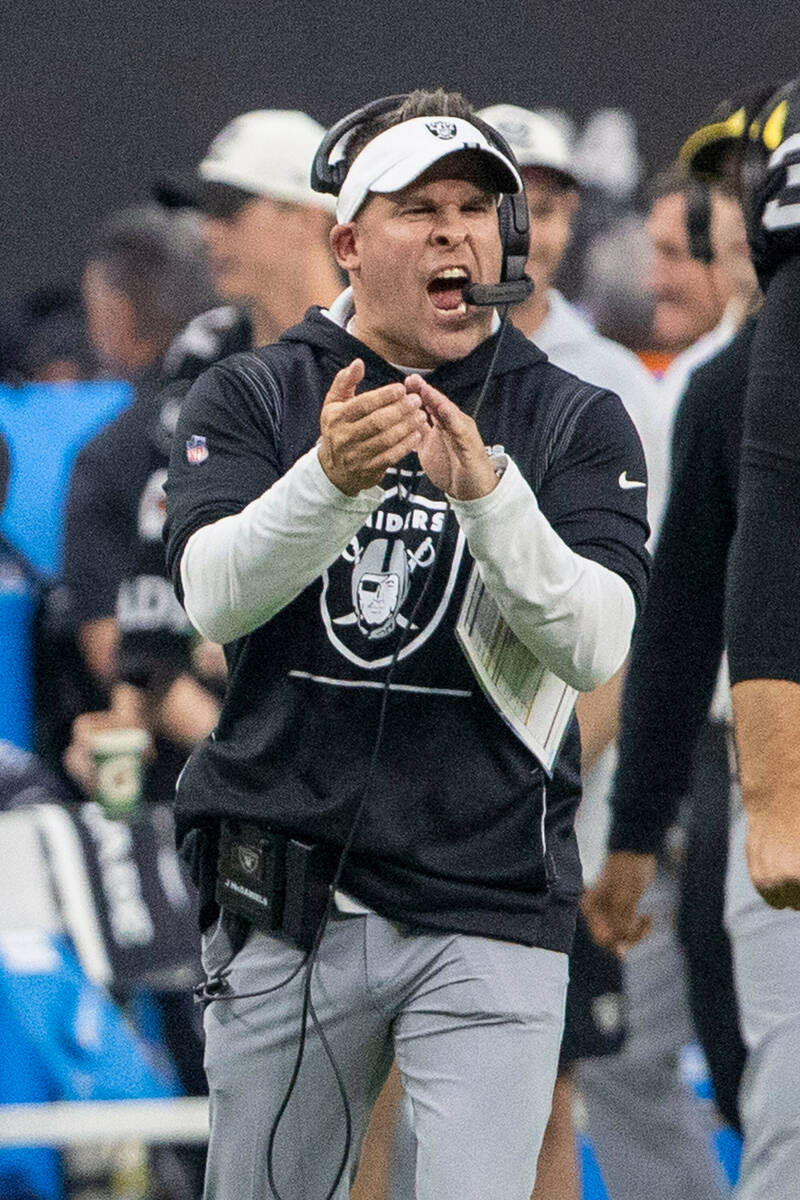 Raiders head coach Josh McDaniels celebrates Josh Jacobs’ touchdown score, not pictured, ...