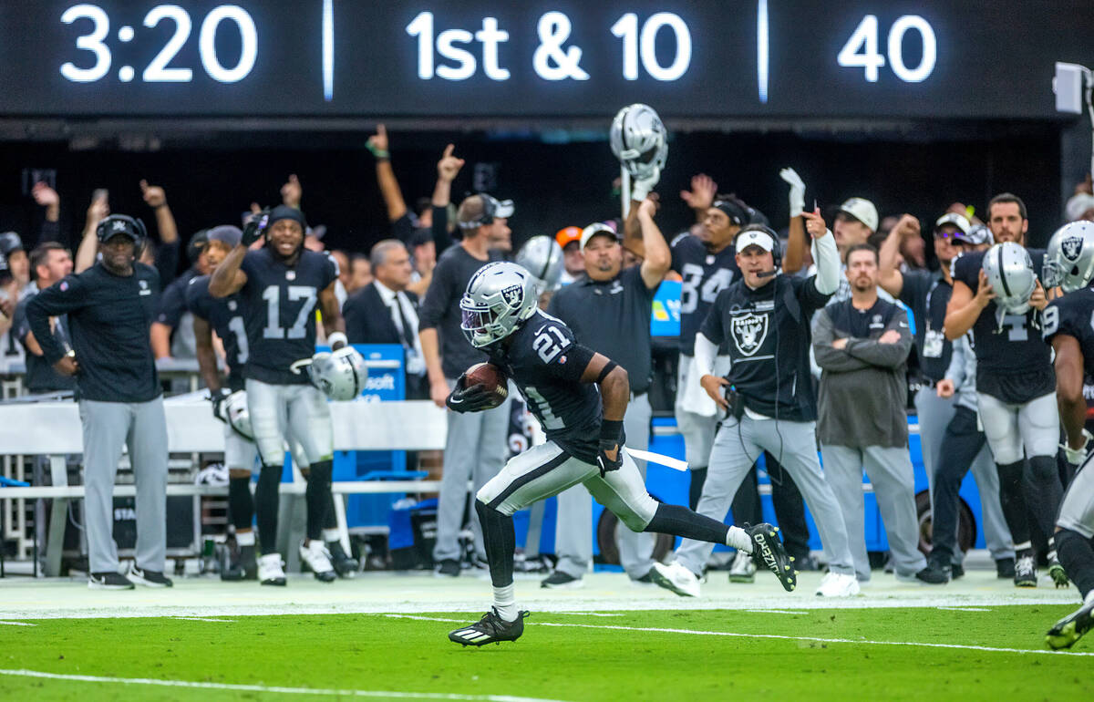 Raiders cornerback Amik Robertson (21) runs down the sidelines following a fumble recovery on h ...