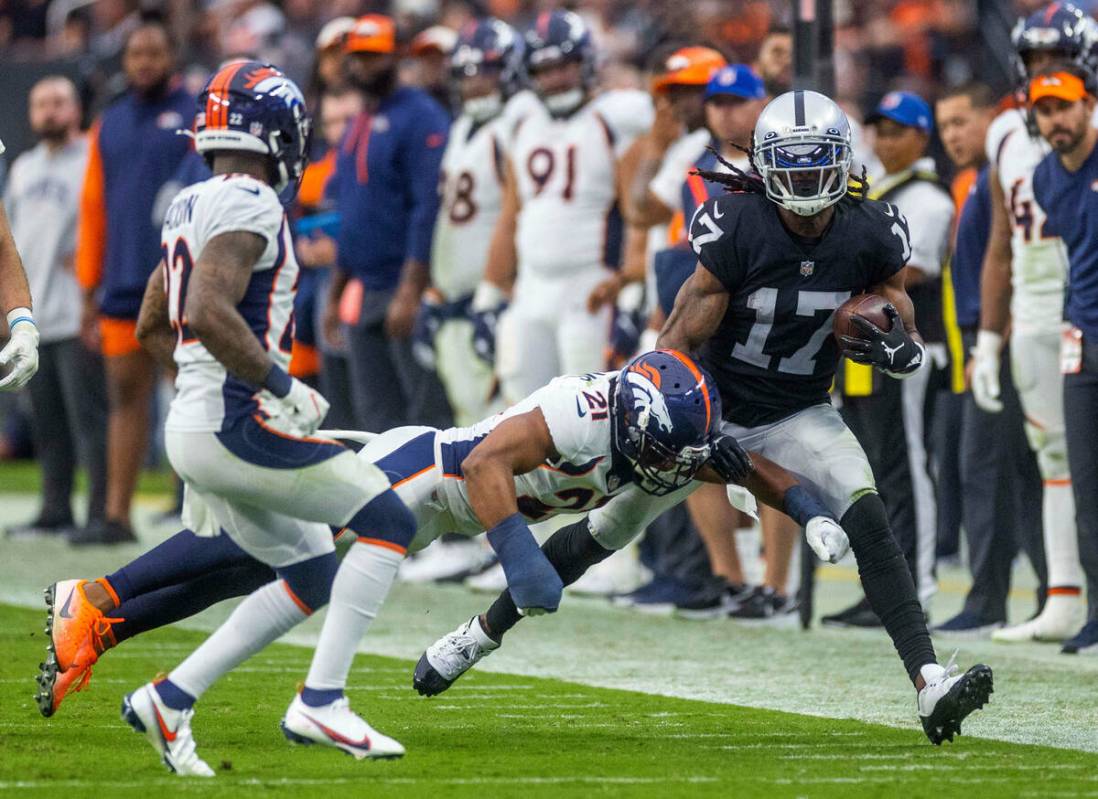 Raiders wide receiver Davante Adams (17) runs down the sidelines following a catch as Denver Br ...