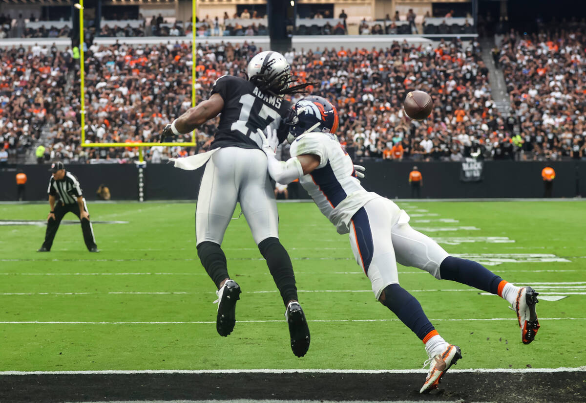 A touchdown pass intended for Raiders wide receiver Davante Adams (17) is broken up by Denver B ...