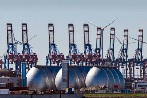 FILE - Tanks for producing bio gas are pictured at the harbor in Hamburg, Germany, on April 19, ...