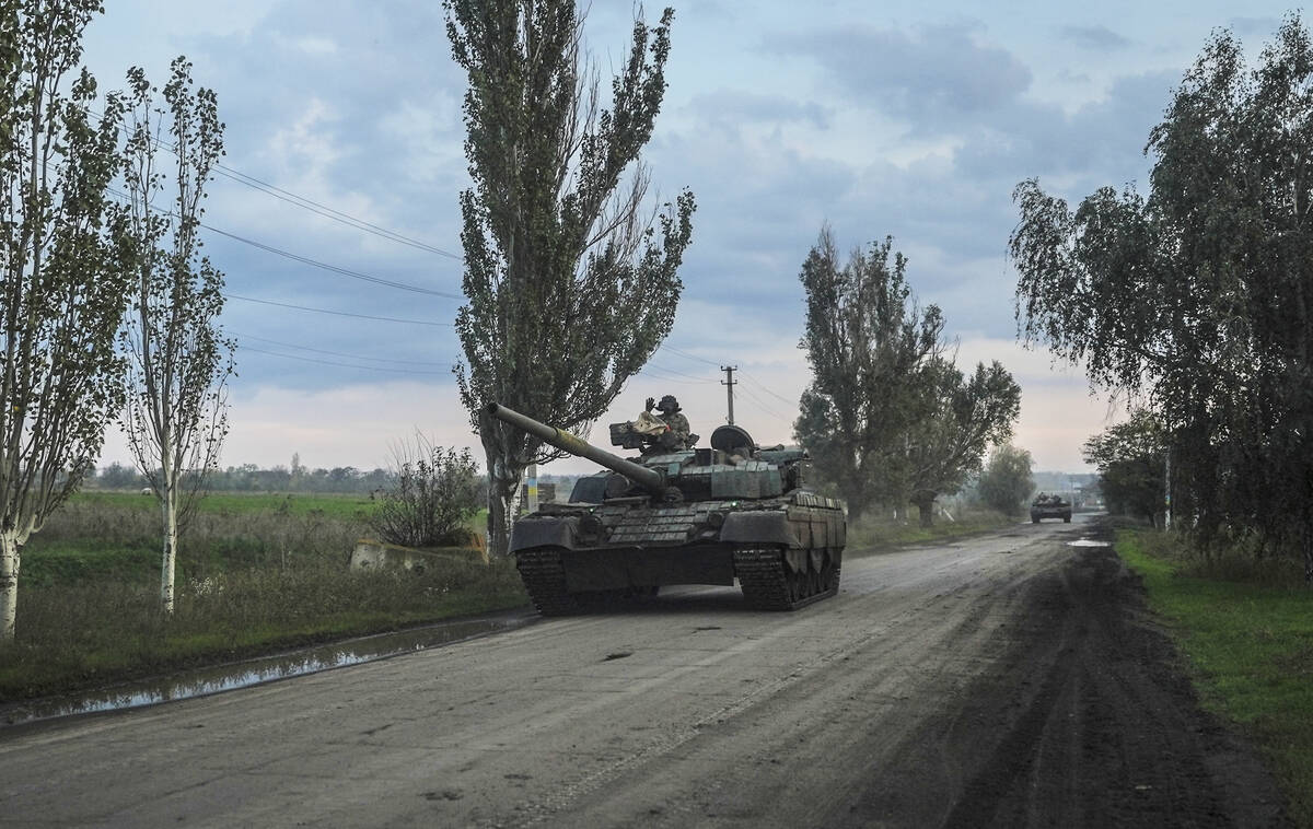 Ukrainian servicemen drive a tank on the way to Siversk, Donetsk region, Ukraine, Saturday, Oct ...