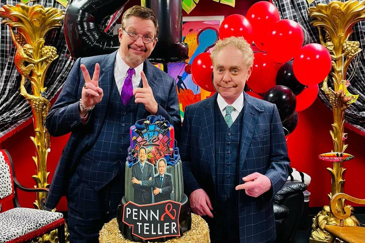 Penn & Teller are shown with their 21st anniversary cake at the Rio on Thursday, Jan. 13, 2022. ...