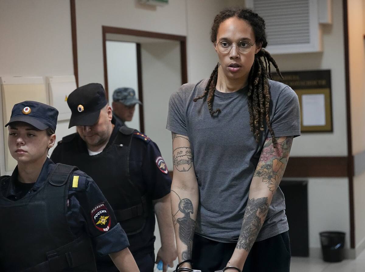 FILE - WNBA star and two-time Olympic gold medalist Brittney Griner is escorted from a courtroo ...