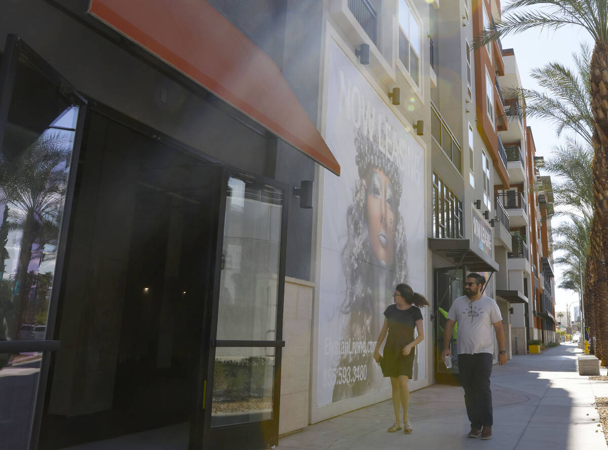 Pedestrians walk past Ely on Fremont, the apartment complex formerly known as Fremont9, is show ...