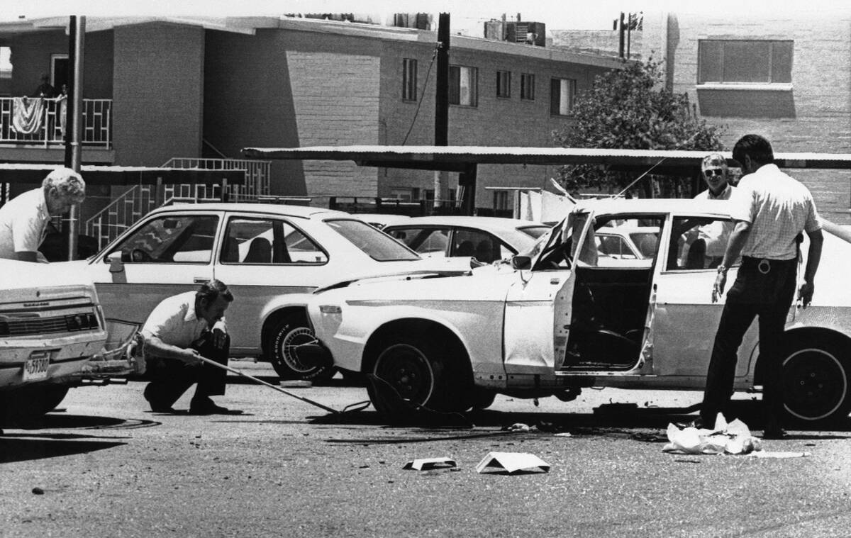 City and federal investigators examined a car damaged on Wednesday, June 3, 1976 in Phoenix, Ar ...