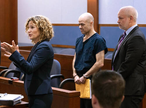 Outgoing Clark County Public Administrator Robert Telles, center, charged with murder in the de ...