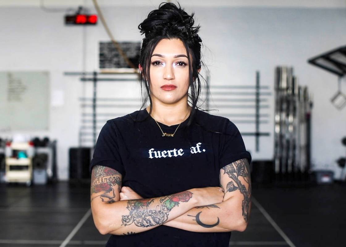 Martinez sports one of Latina Lifters’ signature T-shirts, translated as “Strong AF.” (Ph ...