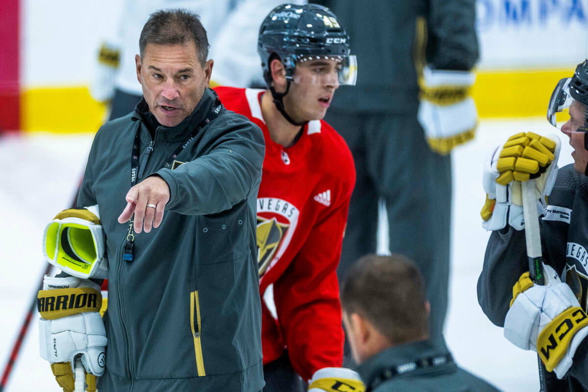 Golden Knights Head Coach Bruce Cassidy, left, addresses his players during practice at City Na ...