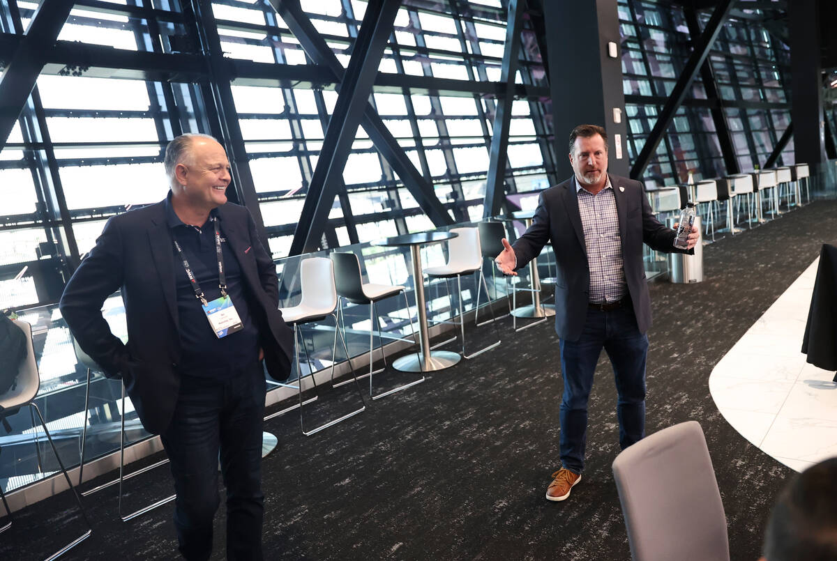 Matt Pasco, vice president for information technology for the Raiders, right, speaks alongside ...