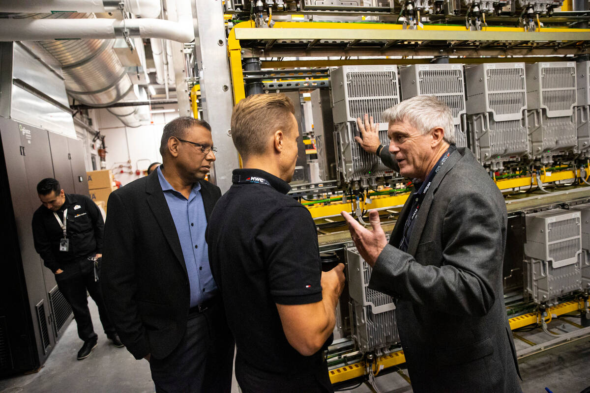 Tony DeMarco, chief people officer and general manager at MatSing, right, talks with Michael Ma ...