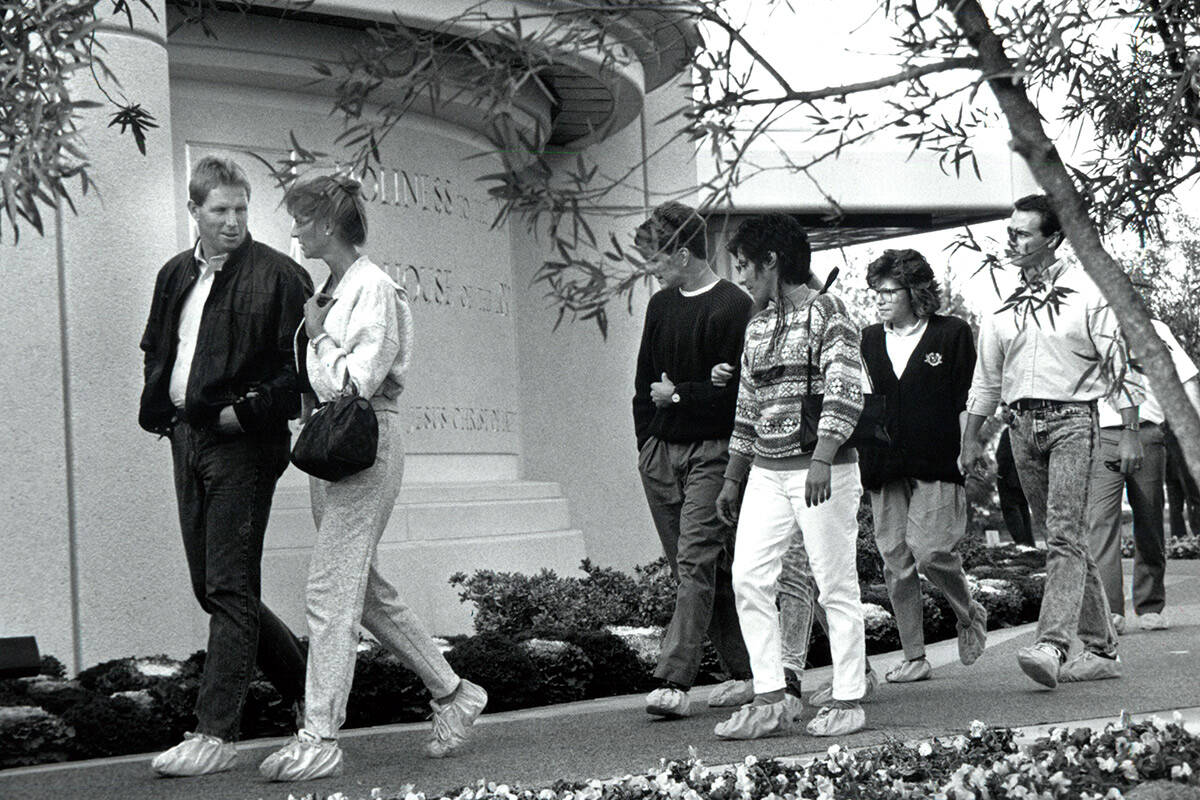 Church of Jesus Christ of Latter-day Saints temple tourers filing toward the main entrance on D ...