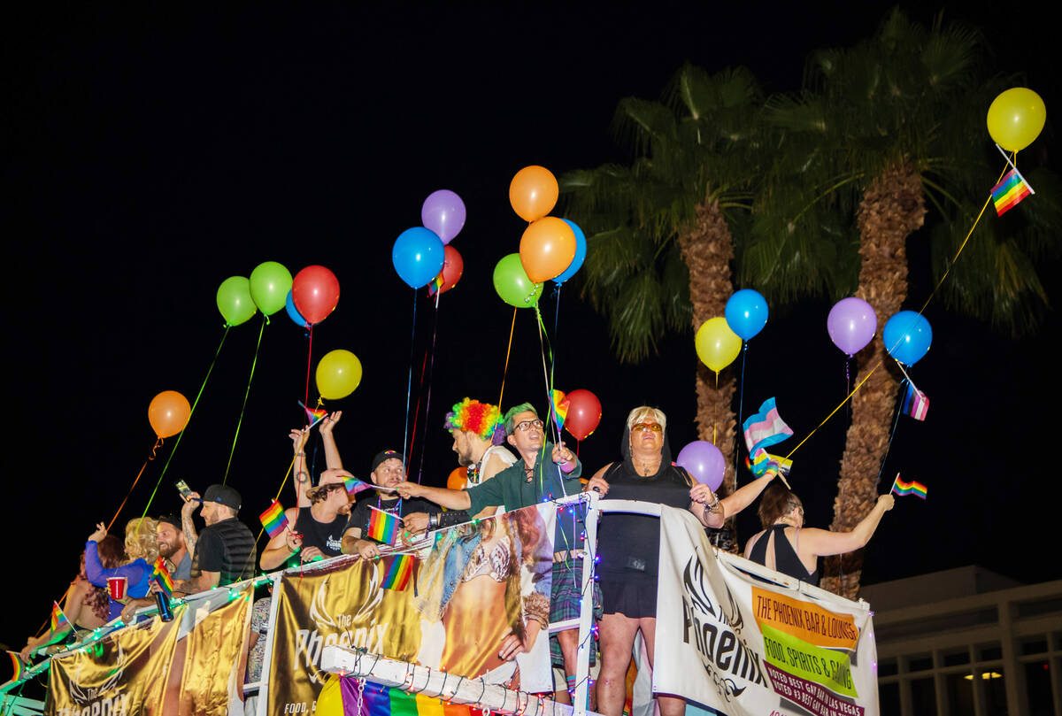 People on top of the Phoenix Bar float in the annual downtown Pride parade on Friday, Oct. 7, 2 ...