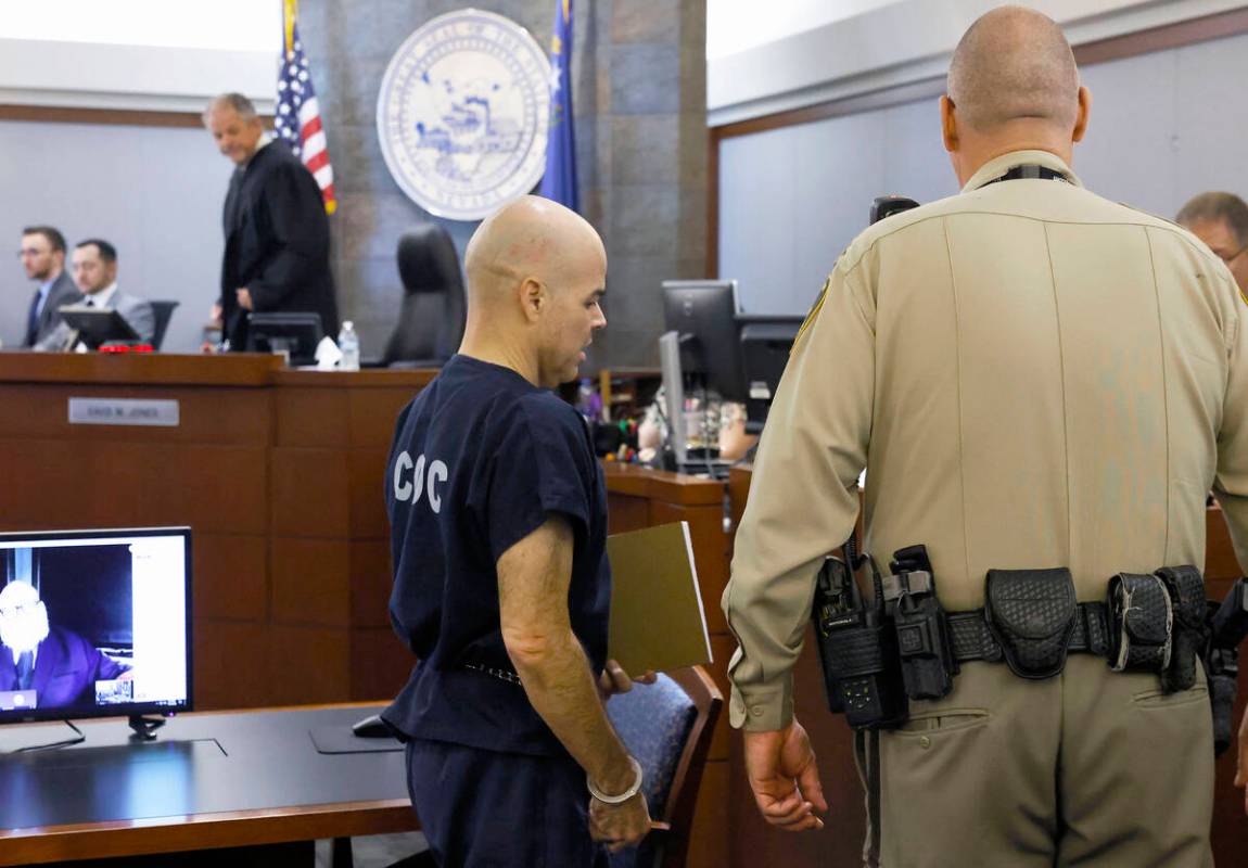Outgoing Clark County Public Administrator Robert Telles, led out of the courtroom at the Regio ...