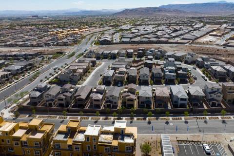 Construction is underway for new development as existing homes are seen from Desert Foothills D ...