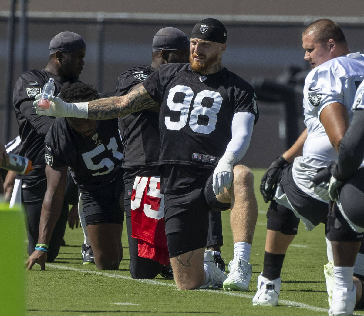 Raiders defensive end Maxx Crosby (98) stretches during practice at the Intermountain Healthcar ...