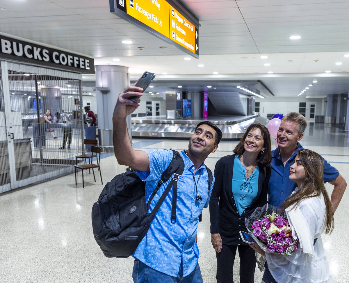 (From left) Mohammad "Benny" Shirzad takes a group selfie with Ellen and Scott Hoffman, and wif ...