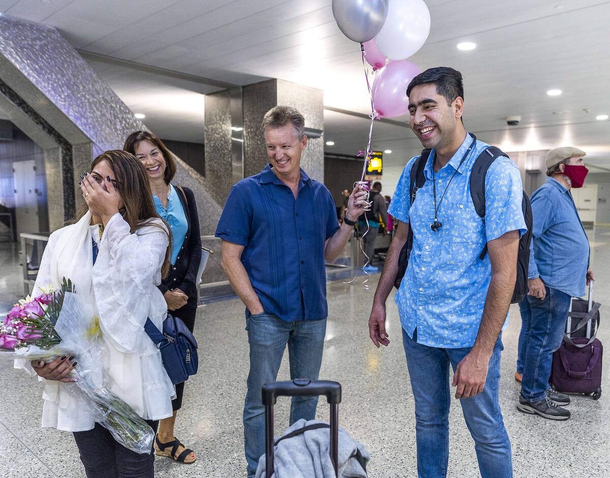(From left) Shabana is overcome as Ellen and Scott Hoffman welcome her to her new home with hus ...