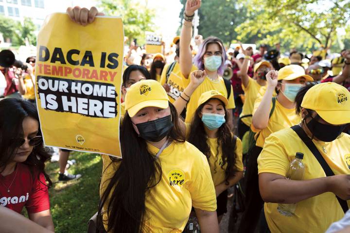 Susana Lujano, left, a dreamer from Mexico who lives in Houston, joins other activists to rally ...