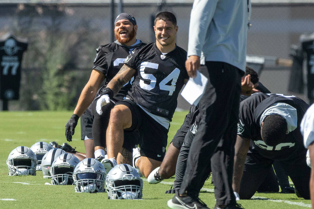 Raiders linebackers Curtis Bolton (36), left, and Blake Martinez (54) stretch during practice a ...