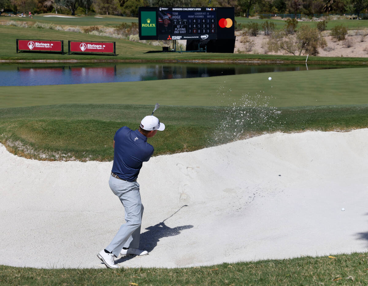 Tom Hoge hits out of the sand on the seventeenth hole during the first round of the Shriners Ch ...