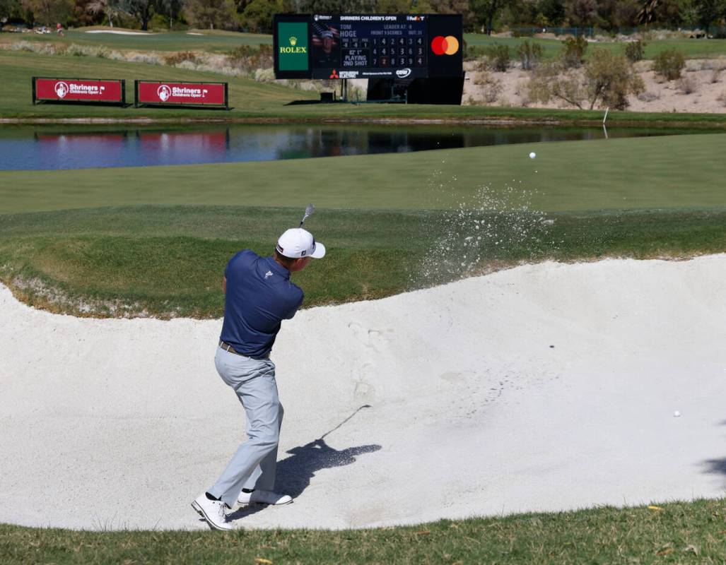 Tom Hoge hits out of the sand on the seventeenth hole during the first round of the Shriners Ch ...
