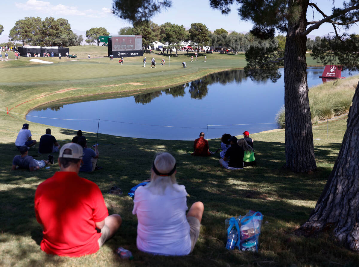Fans watch the first round of the Shriners Children's Open tournament at TPC at Summerlin in La ...