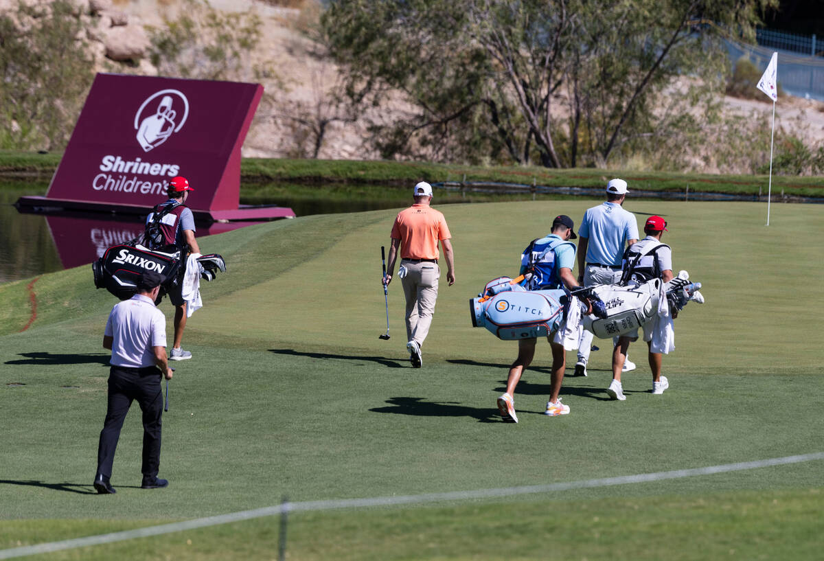Golfers head to the 17th hole during the first round of the Shriners Children's Open tournament ...