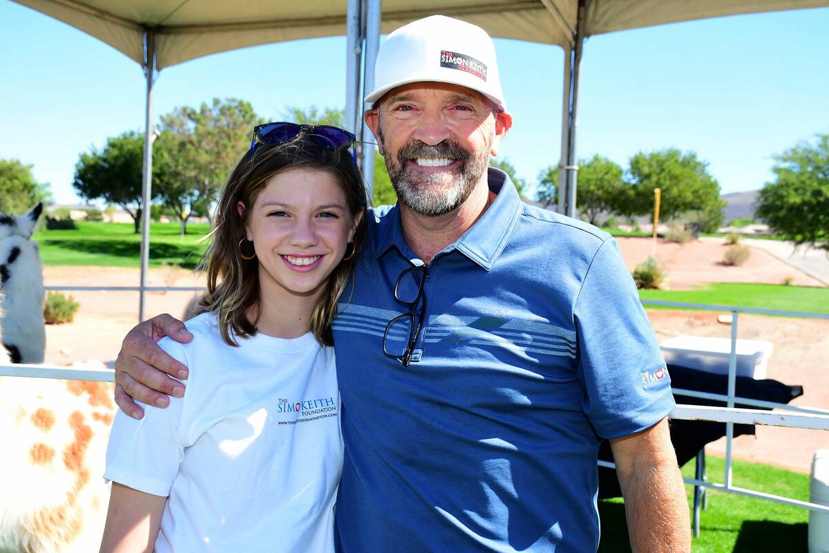 Liver transpant recipient Rowan Sebek, left, was honored by former UNLV soccer star Simon Keith ...