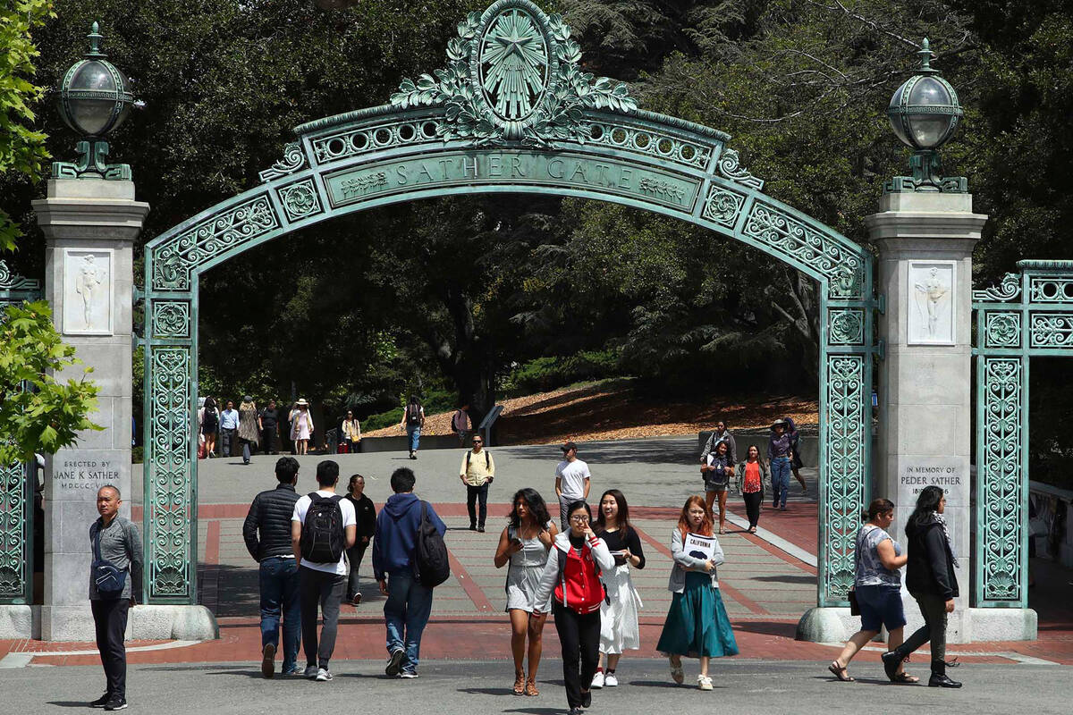 FILE - Students walk past Sather Gate on the University of California at Berkeley campus on May ...