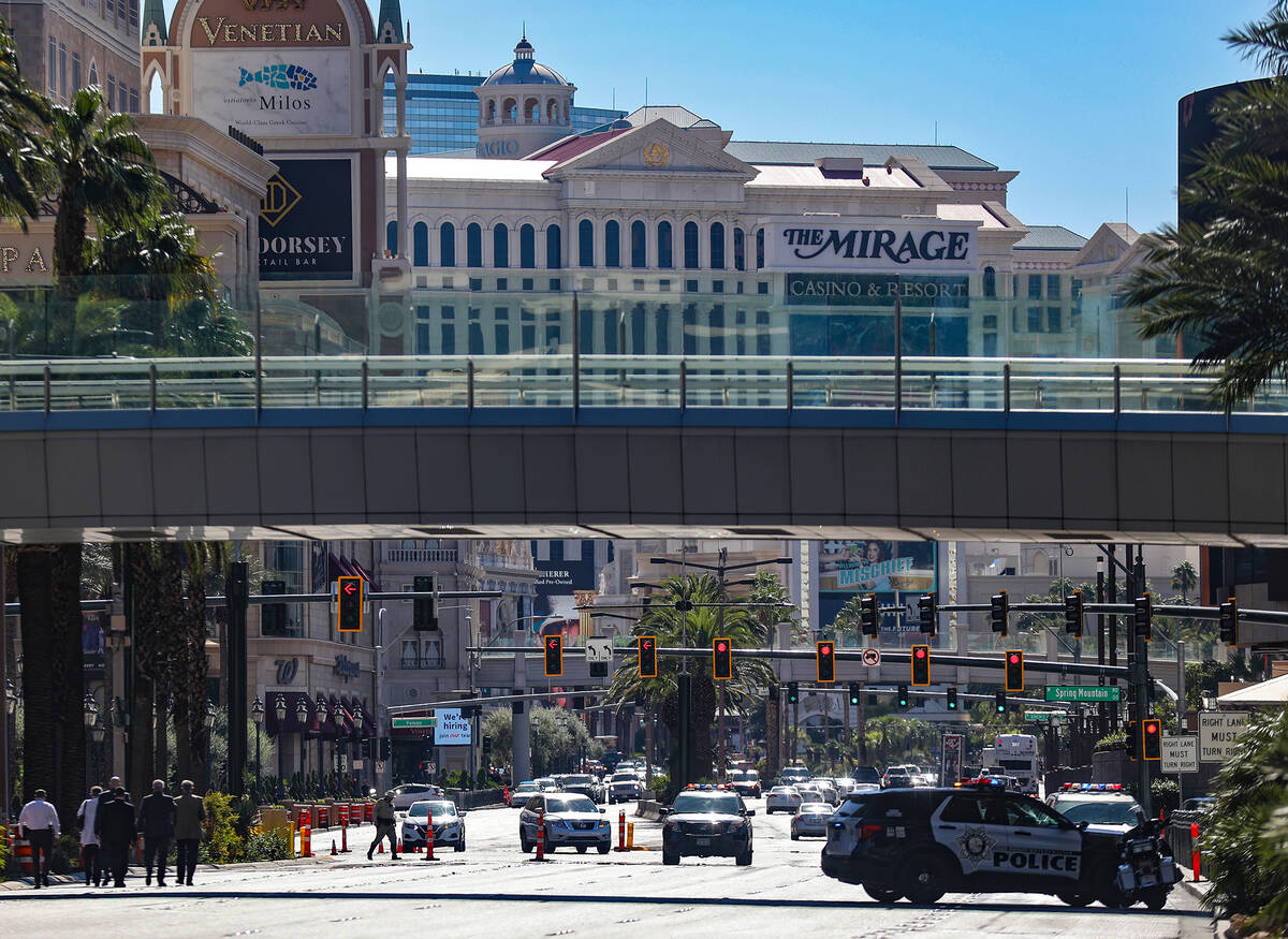 Police at the scene where multiple people were stabbed in front of a Strip casino in Las Vegas, ...
