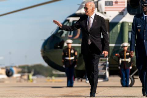 President Joe Biden boards Air Force One at Andrews Air Force Base, Md., Thursday, Oct. 6, 2022 ...