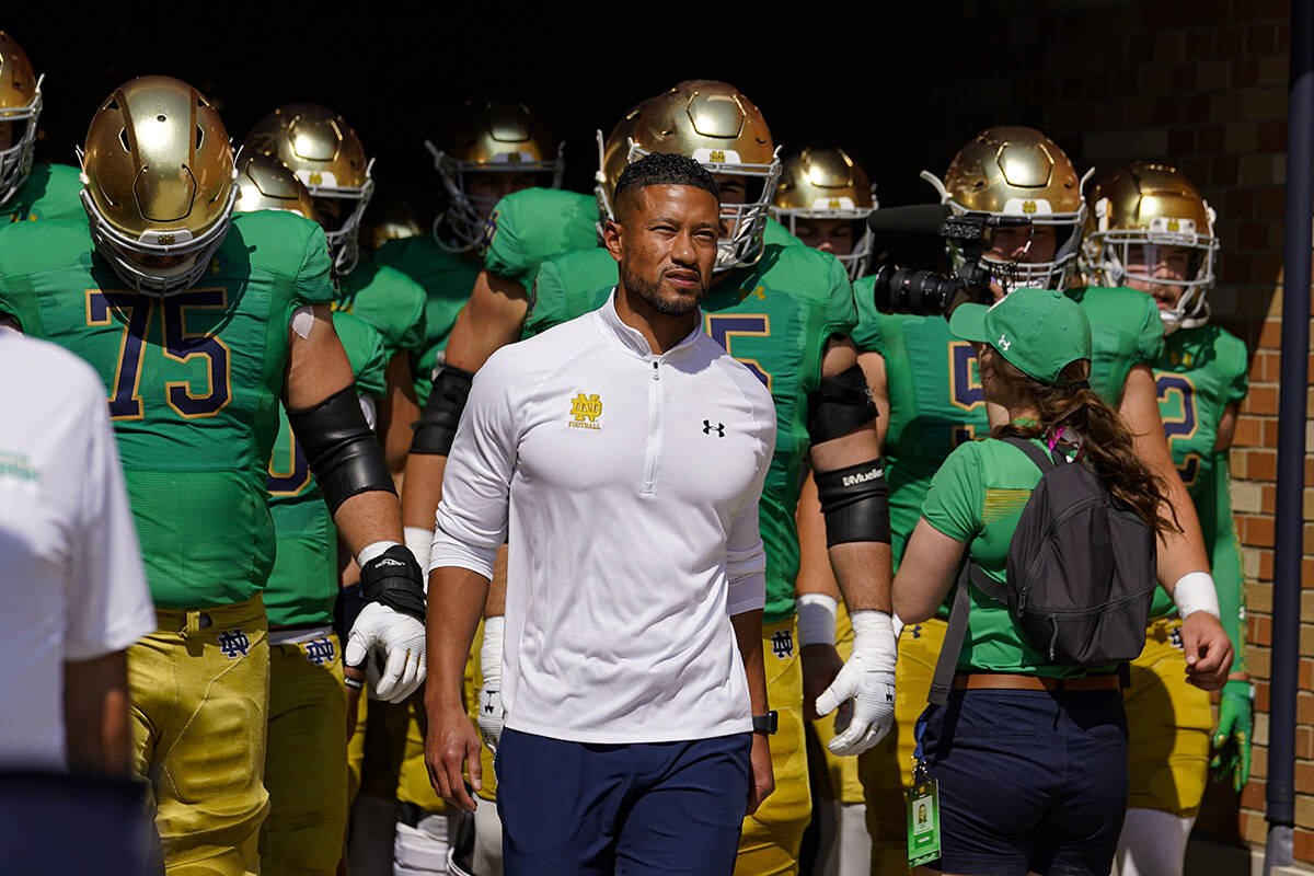 Notre Dame head coach Marcus Freeman leads his team through the tunnel and to the field before ...