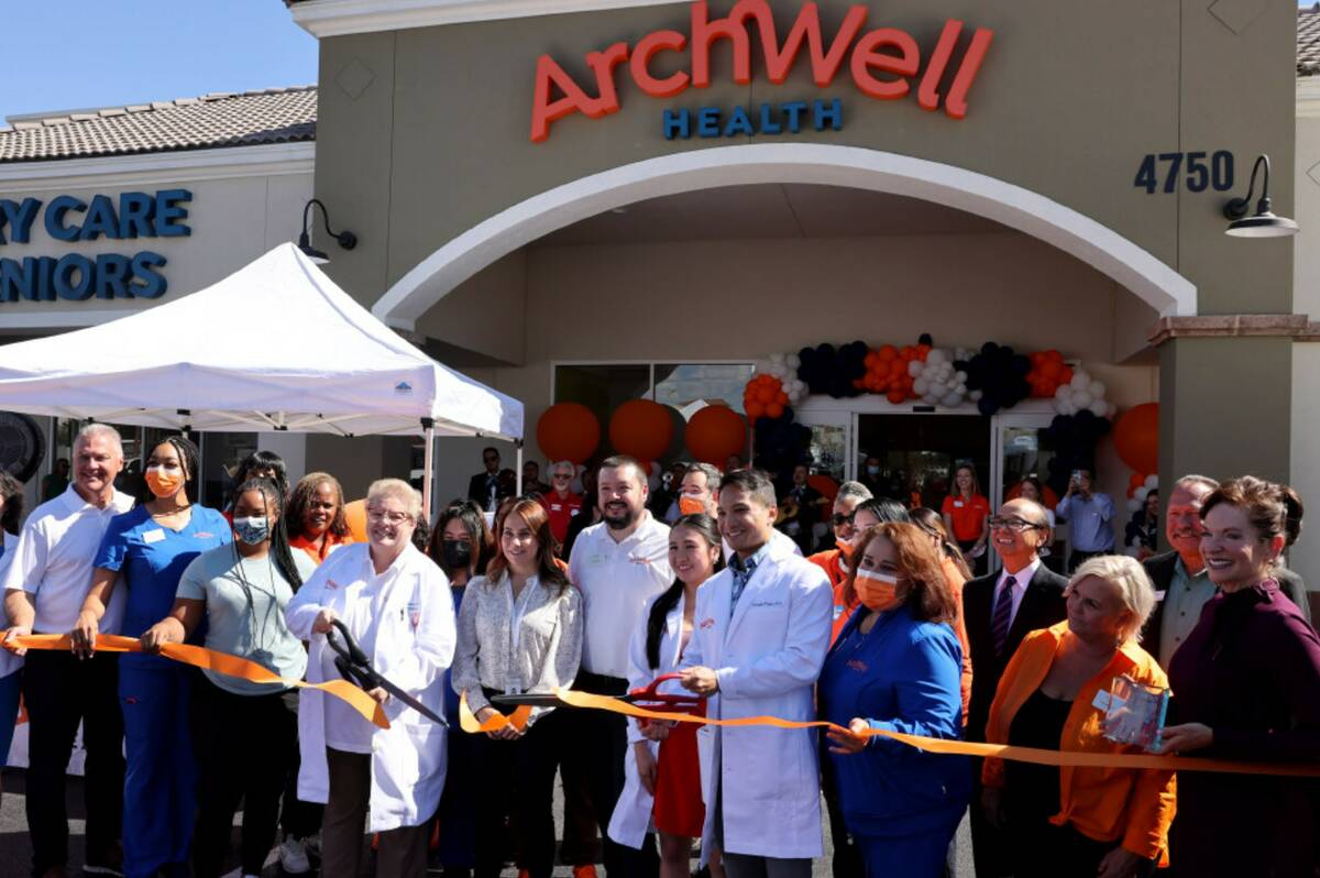 Staff members cut the ribbon to open an ArchWell Health center on West Sahara Avenue in Las Veg ...