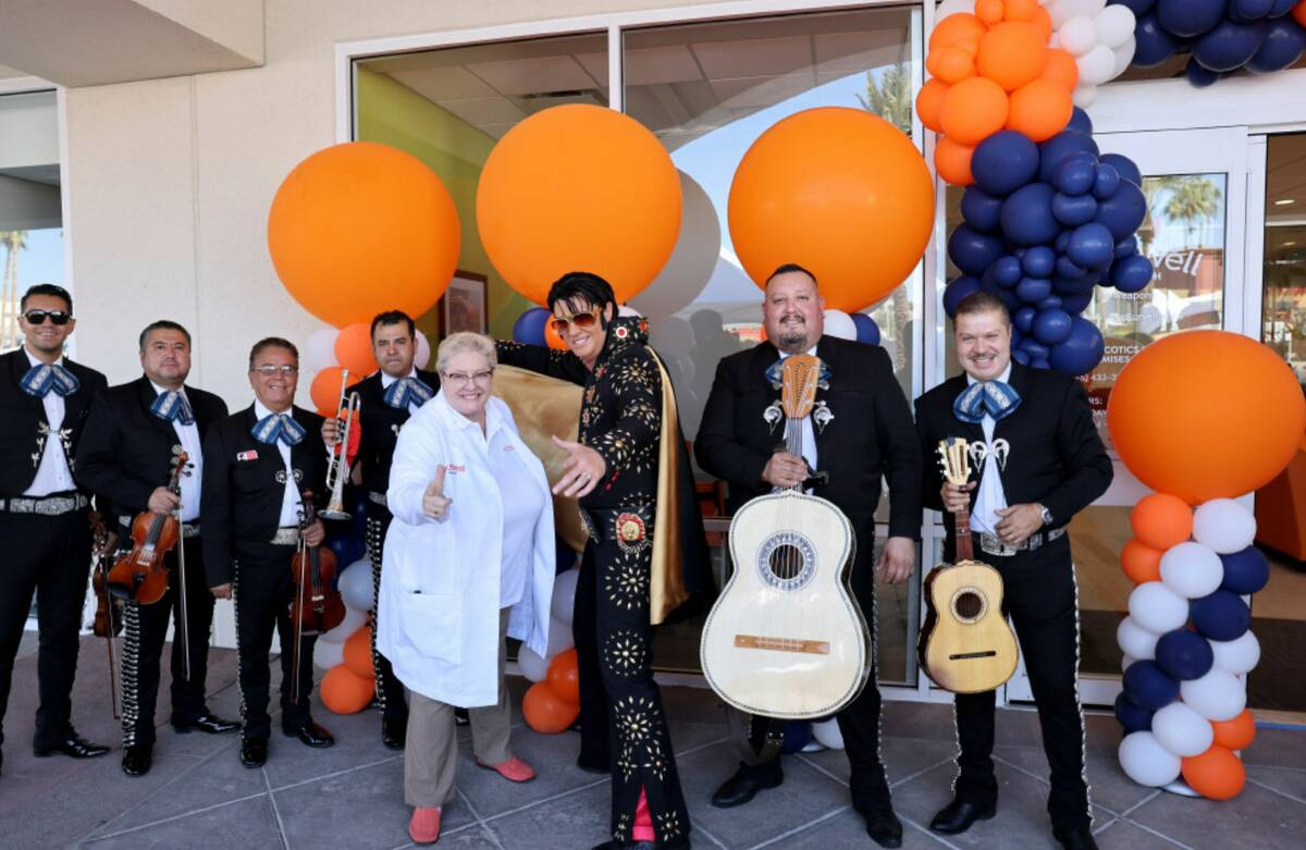 Linda Johnson, mountain west medical director for ArchWell Health, and “Elvis Steve” pose w ...