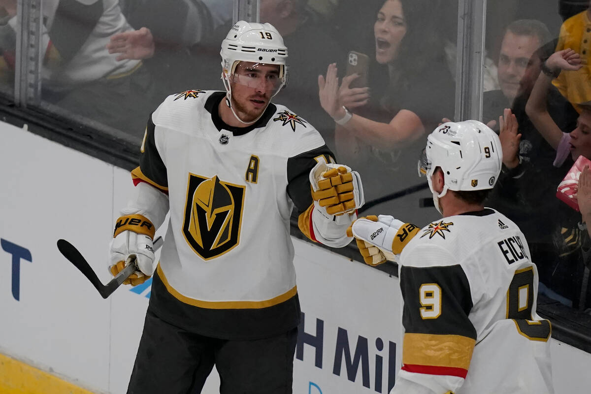 Vegas Golden Knights' right wing Reilly Smith (19) celebrates with teammate center Jack Eichel ...