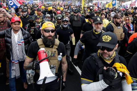 Far-right Proud Boys member Jeremy Joseph Bertino, second from left, joins other supporters of ...