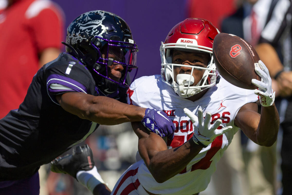 Oklahoma wide receiver Marvin Mims (17) is unable to catch a pass as TCU cornerback Tre'Vius Ho ...