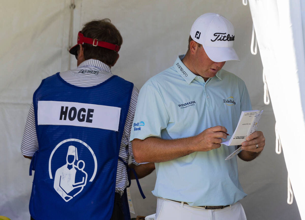 Tom Hoge logs his strocks at the tenth as he prepares to tee off during the second round of the ...