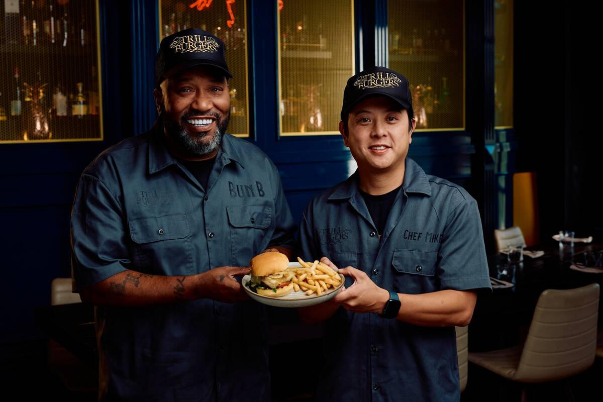 Founder Bun B and Chef Mike Pham pose with a burger from their restaurant, Trill Burgers. Pepsi ...