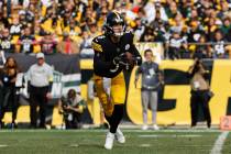 Pittsburgh Steelers quarterback Kenny Pickett scrambles against the New York Jets during an NFL ...